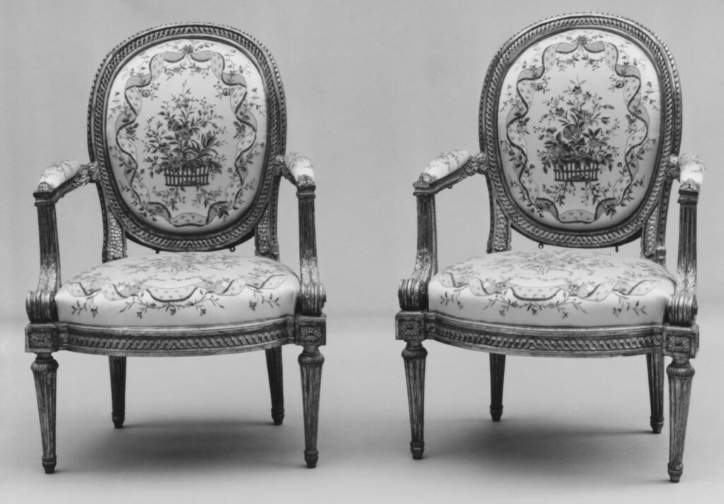 two identical armchairs sit side by side